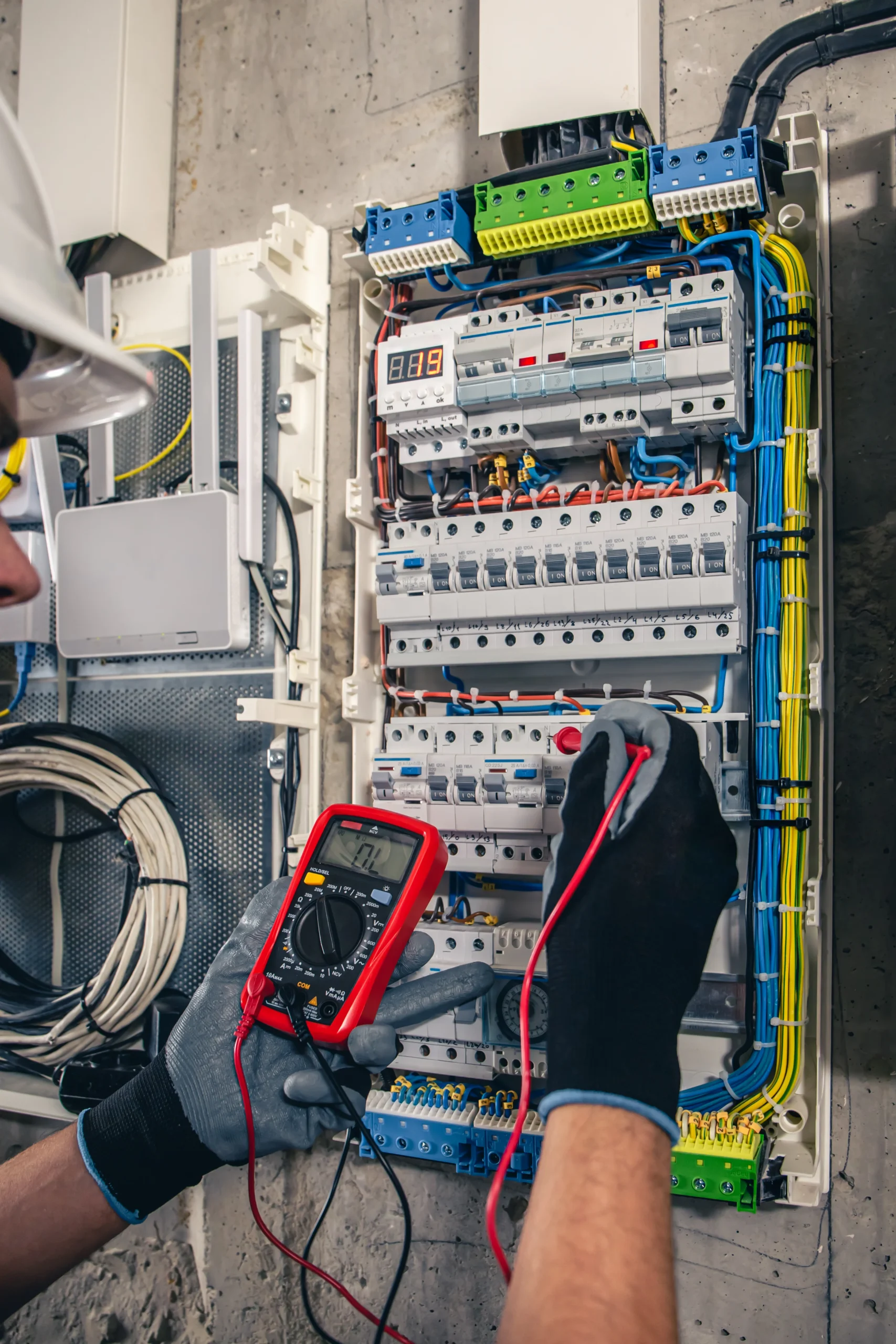 man-electrical-technician-working-switchboard-with-fuses